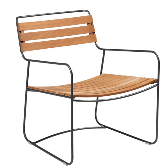 Antracite Surprising Teak Low Armchair by Fermob, outdoor metal chair with sleek design and low armrests, suitable for patio or garden.