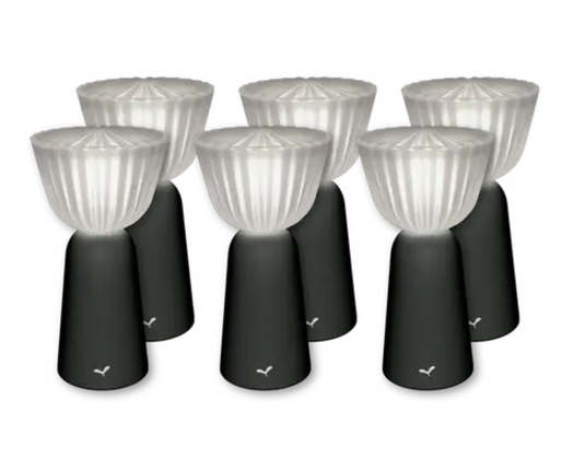 Set of six Fermob Swing outdoor rechargeable lamps in antracite, 20 cm height, arranged outdoors for ambient lighting.