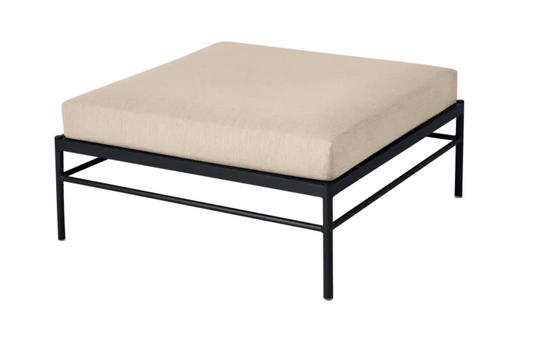 Fermob Rivage outdoor ottoman with antracite twine fabric and aluminium frame, used as a lounge footstool.