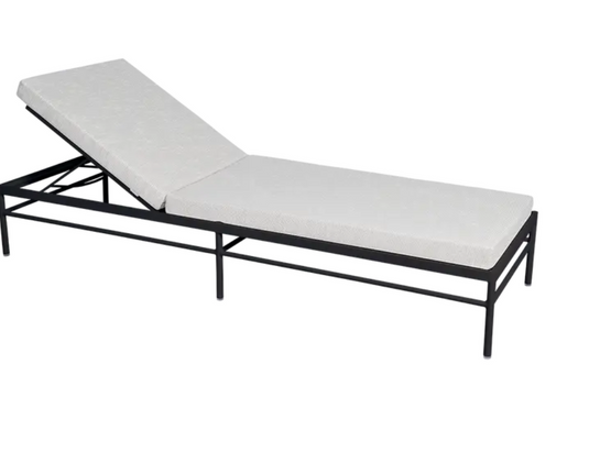 Fermob Rivage luxury sunlounger with metal frame and anthracite wicker, designed for outdoor relaxation.