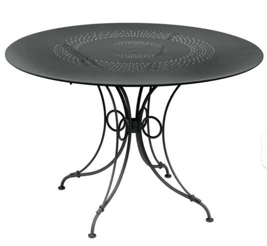 Round Fermob 1900 outdoor table with 117 cm diameter in anthracite, suitable for outdoor dining and patio use.