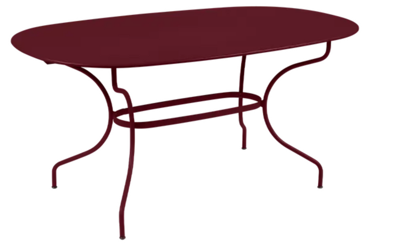 Load image into Gallery viewer, Fermob OPÉRA+ oval metal outdoor table, 160x90 cm, six-seater with cherry finish, suitable for patio or garden dining.
