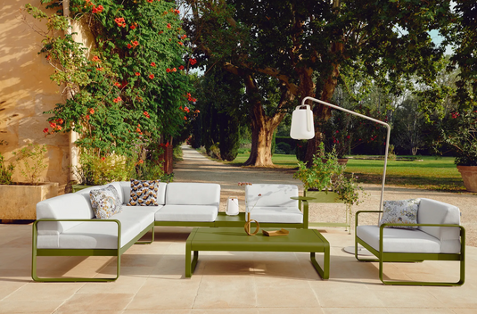 Fermob BALAD² Big Outdoor Lamp, 38 cm tall, spherical design, suitable for outdoor use, illuminated in a modern backyard setting.