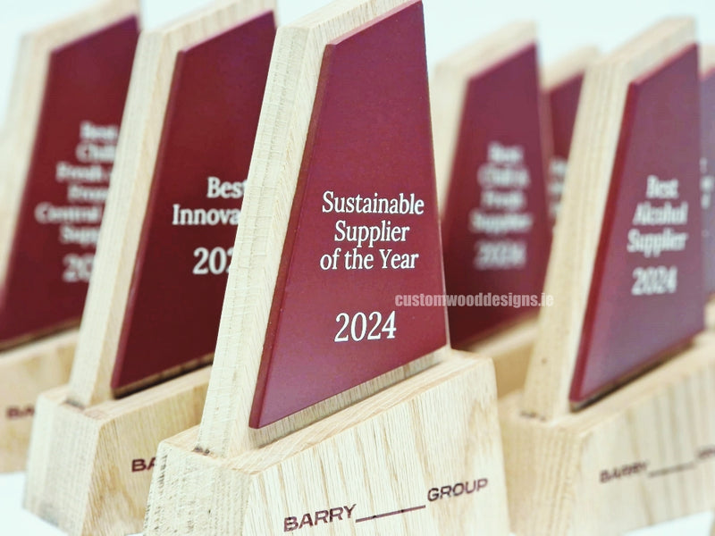 Load image into Gallery viewer, Custom Wood Designs custom-made awards featuring engraved plaques, presented on a wooden display with multiple awards.

