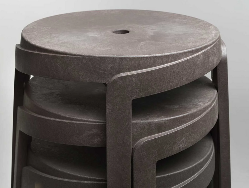 Load image into Gallery viewer, Nardi Basalto Stack Mini Stool outdoor chair made of sustainable material, shown stacked on a patio setting.
