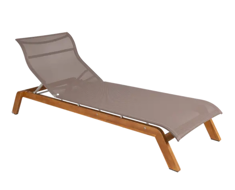 Load image into Gallery viewer, Fermob Maui teak sunlounger with beige Batyline fabric and teak frame for outdoor relaxation and lounging.
