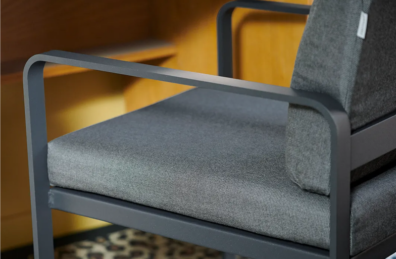 Load image into Gallery viewer, Fermob Bellevie outdoor dining armchair with a nutmeg gray finish, featuring a sturdy frame and comfortable armrests.
