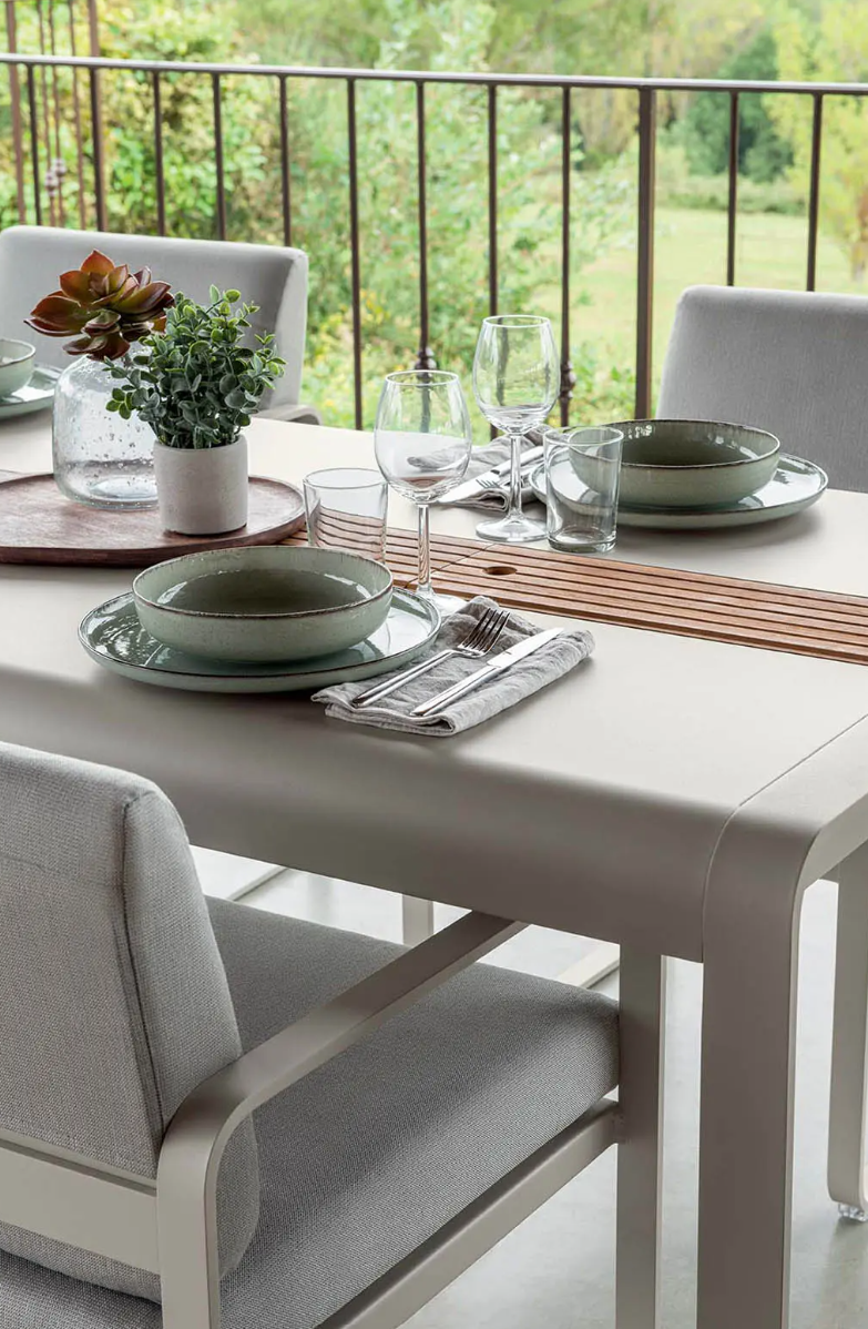 Load image into Gallery viewer, Outdoor Fermob BELLEVIE Dining Armchair in Nutmeg Grey Toupe with a woven seat and armrests, designed for comfortable outdoor dining.
