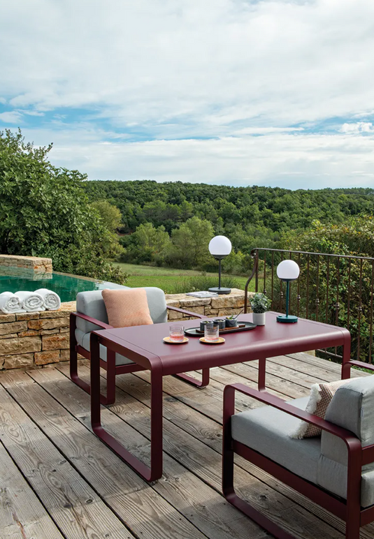 Fermob Bellevie armchair with a sleek metal frame and comfortable cushion, perfect for modern indoor or outdoor seating.