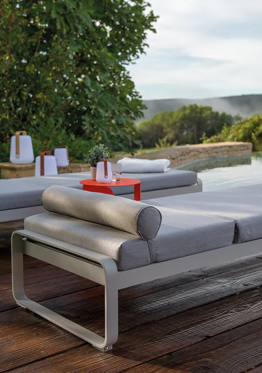 Fermob Bellevie premium sunlounger with sleek design and adjustable backrest, ideal for outdoor relaxation on a sunny patio.