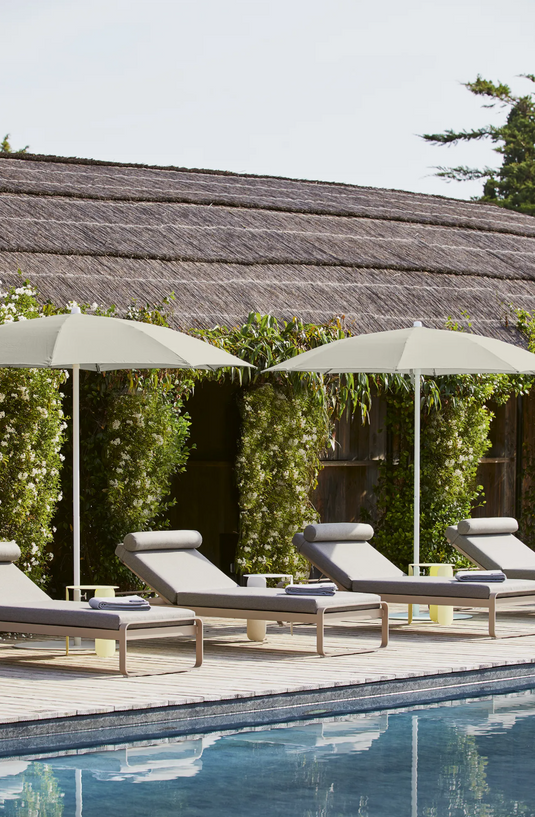 Fermob Bellevie Premium Sunlounger with adjustable backrest and sleek metal frame for outdoor relaxation.