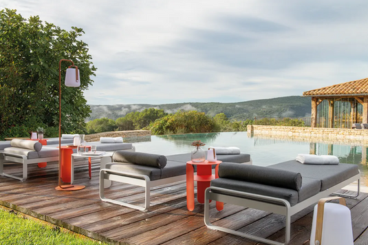 Fermob Bellevie premium sunlounger with sleek design, adjustable backrest, and comfortable seating for outdoor relaxation.