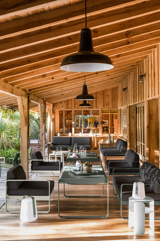 Fermob Bellevie 2-seater outdoor sofa with metal frame and cushioned seats, perfect for patio or garden lounging.