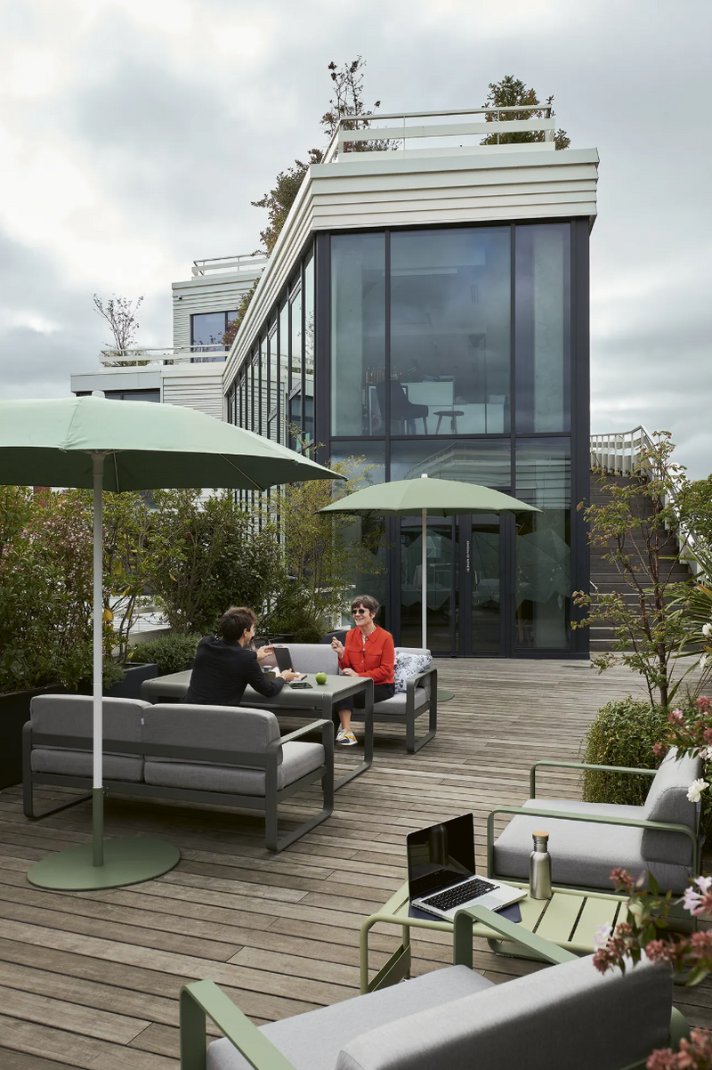 Load image into Gallery viewer, Fermob Bellevie 2-Seater outdoor sofa with light grey cushions and woven metal frame, perfect for patio relaxation.
