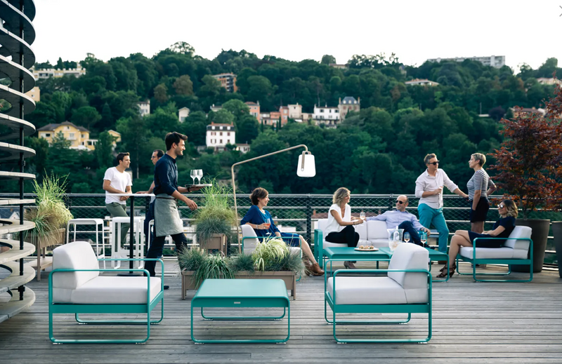 Load image into Gallery viewer, Fermob Bellevie high bar stool with wooden seat and metal frame, outdoor furniture suitable for modern kitchen or patio settings.
