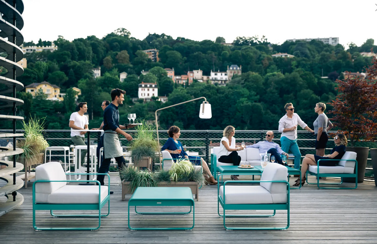 Fermob Bellevie high bar stool with a sleek design, suitable for outdoor use, featuring a sturdy metal frame and comfortable seat.