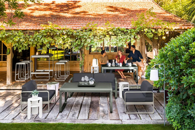 Load image into Gallery viewer, Fermob Bellevie high bar stool with a sleek metal frame and wooden seat, ideal for outdoor or indoor bar settings.
