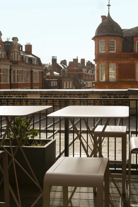 Fermob Bellevie high bar stool with a sleek modern design, outdoor-ready with metal frame and comfortable seating.