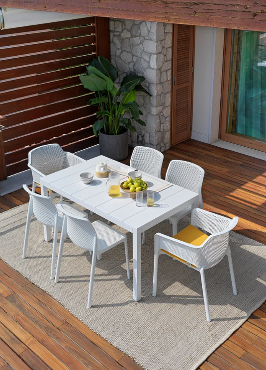 Nardi Rio Alu 140 Extensible Outdoor Table in white with aluminum frame, set up outdoors on a patio.
