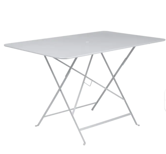 Fermob foldable bistro table, 117x77 cm, outdoor metal design with a sleek, portable style suitable for patios and small outdoor spaces.