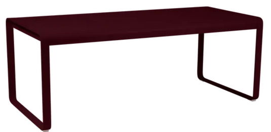 Black Fermob Bellevie outdoor dining table in black cherry finish, 196 x 90 cm, metal eight-seater for outdoor dining.
