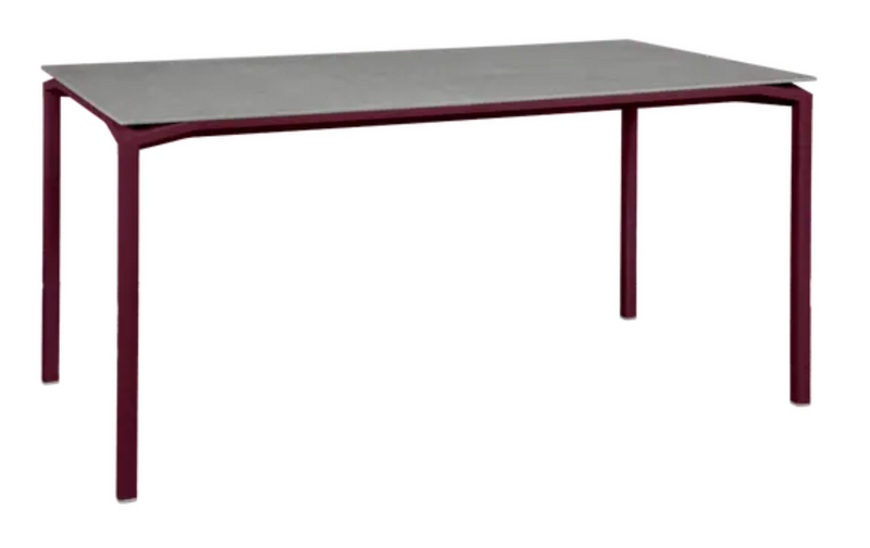 Load image into Gallery viewer, Fermob CALVI Creta mineral dining table in black, gray, and cherry colors, 160x80 cm, six-seater outdoor table.
