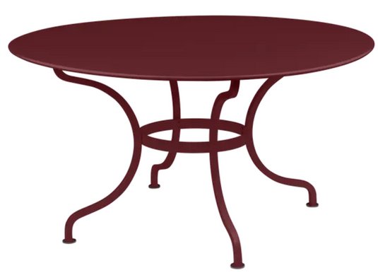 Black Fermob Romane round table with a black cherry finish, 137cm diameter, seating up to 8 guests, suitable for indoor or outdoor use.