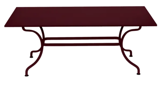 Black Fermob Romane table measuring 180 x 100 cm, designed for up to 8 guests, shown in black cherry finish.