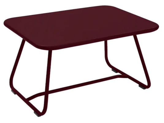 Black Fermob Sixties low outdoor table with 76x55.5cm surface, ideal for patio or garden seating areas.