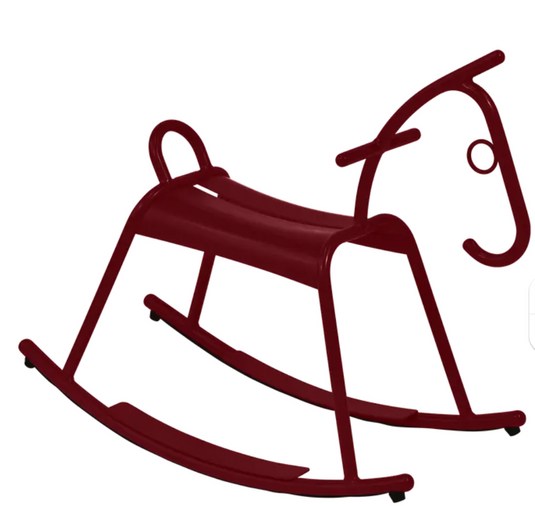 Fermob ADADA rocking horse for kids' restaurant furniture in black, cherry, and white colors, designed for kids' waiting area.