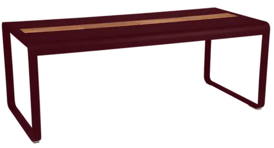 Black Fermob Bellevie outdoor dining table with wood and metal construction, 196 x 90 cm, eight seater with built-in storage.