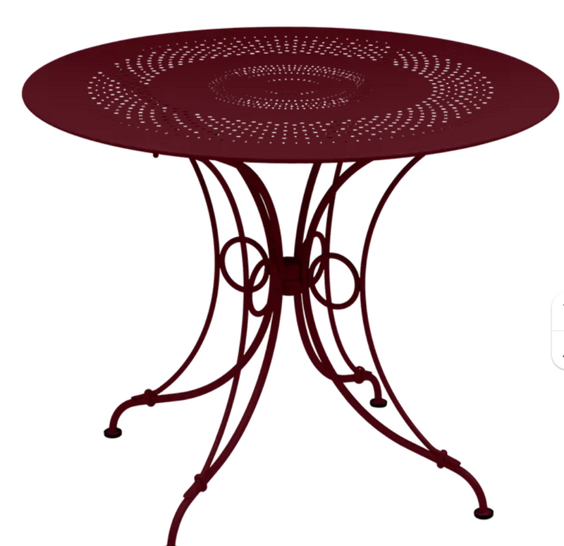 Load image into Gallery viewer, Black Fermob 1900 outdoor table with 96-inch diameter, showcasing a sleek, modern design for outdoor furniture.
