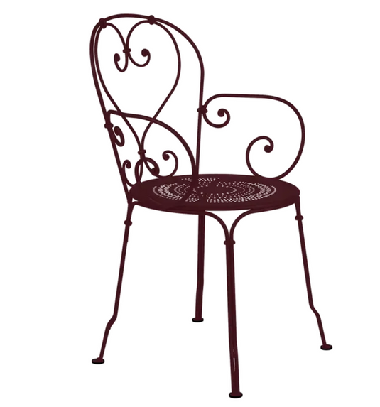 Black Fermob 1900 Lounge Armchair with curved armrests and sleek design, perfect for outdoor patio seating.