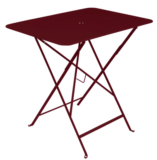 Black Fermob Bistro Table 77x57 cm, foldable outdoor metal table with a sleek cherry finish for patio or garden use.