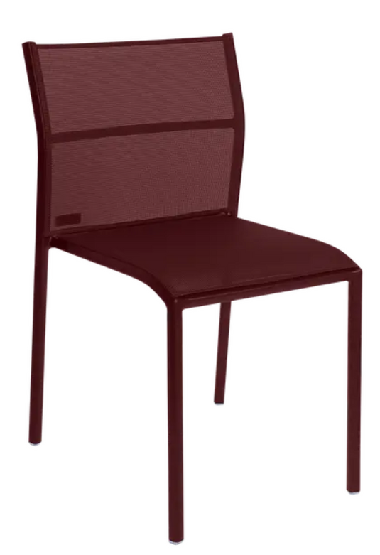 Black Fermob Cadiz outdoor chair with a sleek, curved design, ideal for garden or patio seating.
