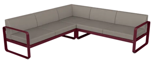 Fermob Bellevie Composition 2 outdoor lounge set with black, cherry, grey, and taupe cushions on a modern sofa.