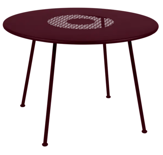 Black Fermob Lorette round metal garden table with 110cm diameter, fire-resistant outdoor furniture.