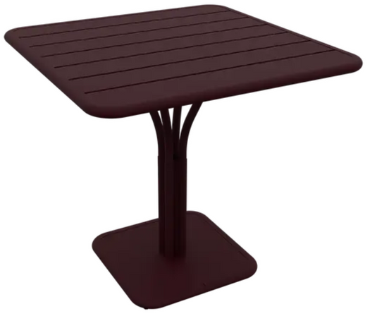 Black Fermob Luxembourg outdoor pedestal table, 80x80 cm, with a sleek design and sturdy pedestal base for outdoor dining and gatherings.
