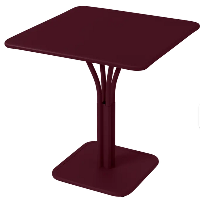 Load image into Gallery viewer, Black Fermob Luxembourg metal outdoor table with a solid top and pedestal base, perfect for restaurant or patio use.
