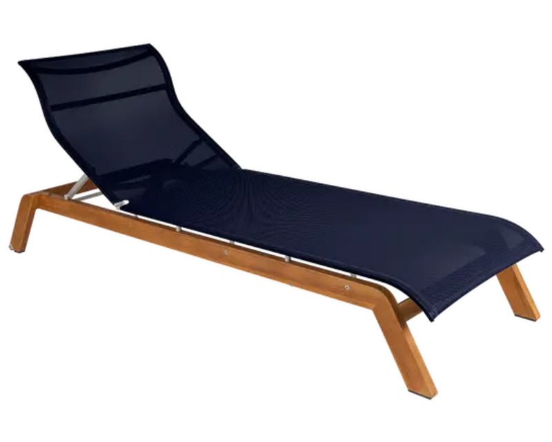 Load image into Gallery viewer, Blue ink Fermob Maui teak sunlounger with Batyline fabric and teak base, ideal for outdoor relaxation on sunny days.
