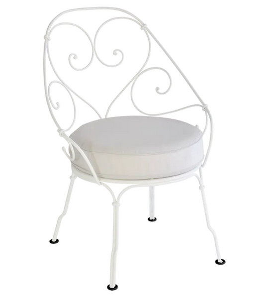 Fermob Cabriolet outdoor armchair with metal frame and colorful woven seat, suitable for garden or patio seating.