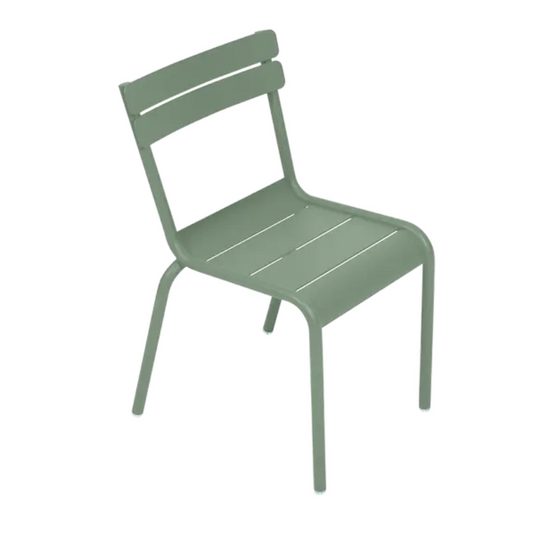 Fermob Luxembourg Kid Chair in vibrant cactus green, designed for children’s corner or restaurant seating, with a modern, playful style.