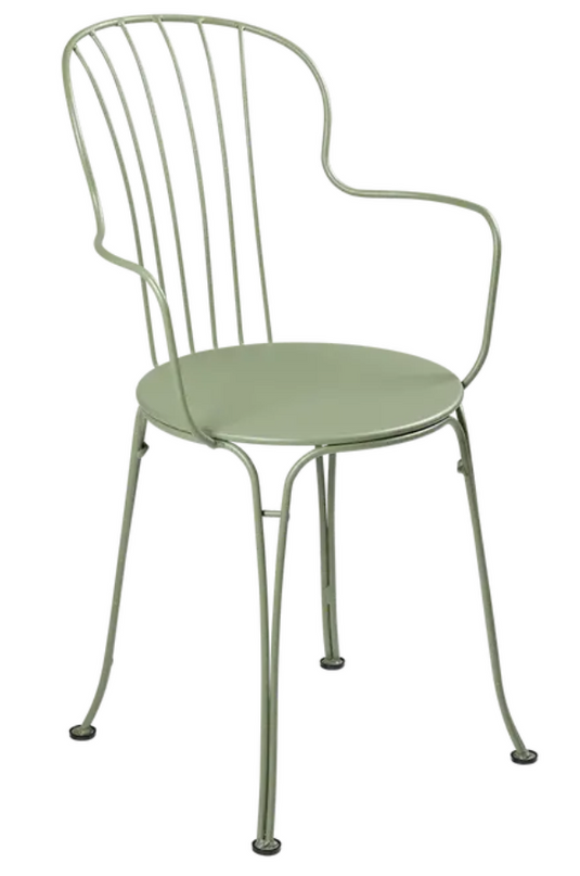Fermob OPÉRA+ outdoor metal armchair with sleek design, featuring a cactus-themed pattern on a vibrant outdoor seating piece.