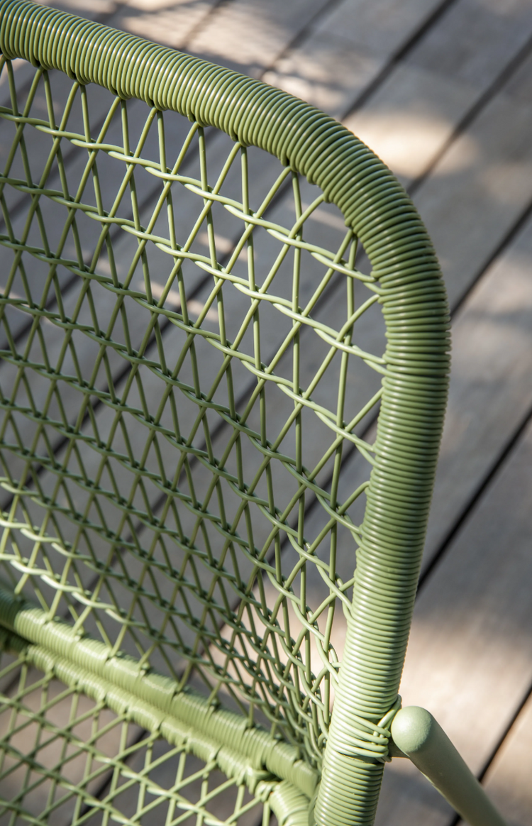 Fermob Sixties Low Armchair woven lounge chair with a stylish design, ideal for outdoor restaurant or patio seating.