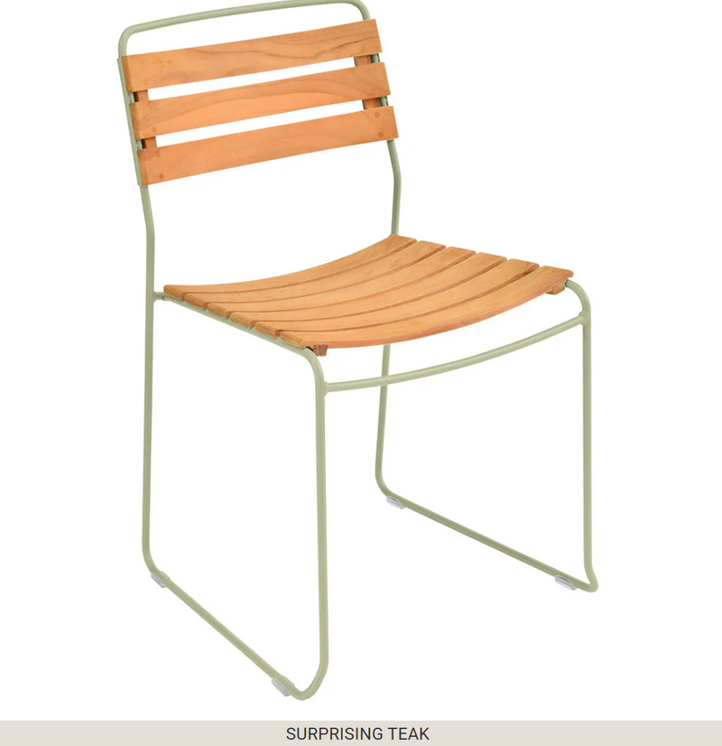 Load image into Gallery viewer, Fermob Surprising Teak Chair, outdoor metal chair with a modern design, shown with a cactus plant on a patio.
