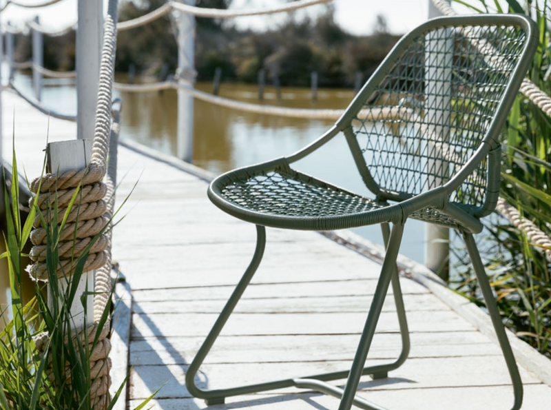 Load image into Gallery viewer, Stackable Fermob Sixties outdoor chair with cactus green finish, designed for restaurant and hospitality seating in Ireland.
