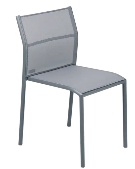 Fermob Cadiz outdoor chair with a woven seat and metal frame, ideal for patio or garden seating.