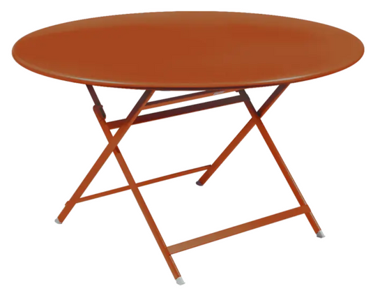 Fermob Caractère foldable metal table with a 128 cm diameter, eight-seater design, in a candied orange finish.