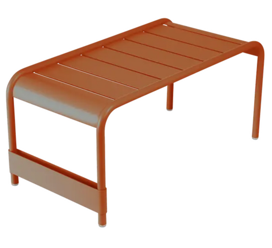 Fermob Luxembourg large low table or bench, orange-colored wooden furniture, measuring 86x44 cm, with a smooth tabletop and sturdy legs.