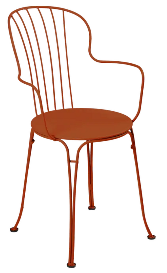 Candied orange Fermob OPÉRA+ outdoor metal armchair with curved armrests and slatted backrest for stylish outdoor seating.